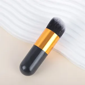 Close-up macro view of portable chubby foundation brush with soft dual-tone bristles