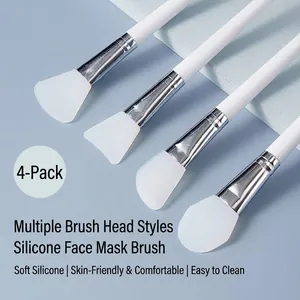 Professional set of 4 silicone face mask brushes with ergonomic white long handles for facial care