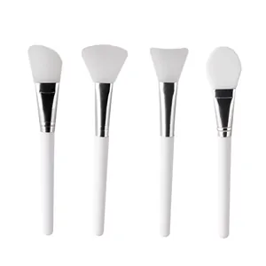 Set of 4 white silicone facial mask brushes for professional beauty treatments
