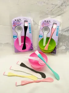 A detailed view of DIY facial mask mixing kits including colorful resin brushes and bowls