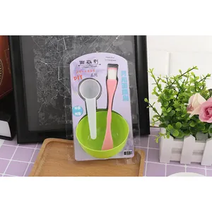 Close-up detail of a 3-in-1 DIY facial mask mixing set including brush, bowl and spoon