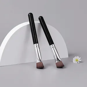 Professional angled makeup brushes for contouring and concealing with black handle