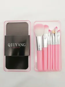 Detailed view of 7-piece pink makeup brush set in a transparent storage case
