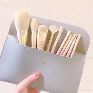Set de 10 pinceaux de maquillage professionnels avec poils souples et pochette grise