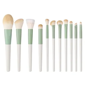 Professional 11-piece Morandi green mini travel makeup brush set with white handles