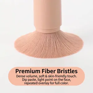 Macro view showing the dense and soft synthetic fiber bristles of a professional makeup brush
