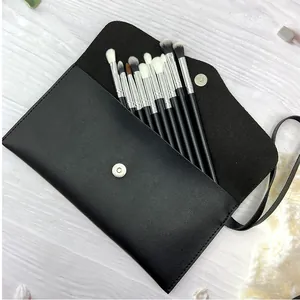 Detailed view of the 11-piece professional eyeshadow brush set inside a black faux leather pouch