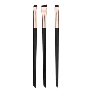 Three professional eye makeup brushes for eyeliner and concealer details on white background