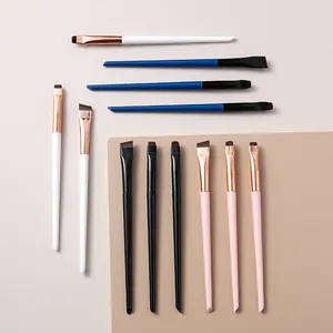 Top-down detailed view showing a variety of eyeliner and concealer makeup brushes