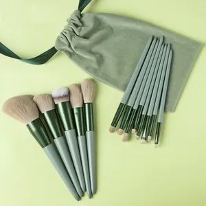 Professional 13pcs green makeup brush set with soft bristles and velvet storage pouch