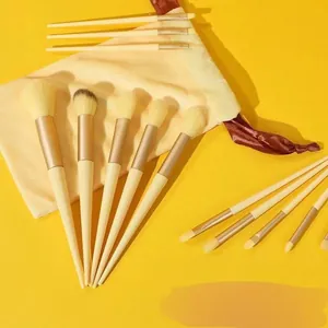 13Pcs soft hair makeup brush set with storage bag for beginners in cream yellow.