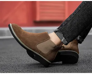 Brown suede men's Chelsea boots featuring elastic side panels and durable black soles.
