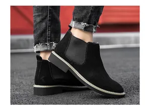 Detailed side view of black suede men's Chelsea boots with fleece lining for winter