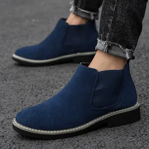 Stylish men's blue suede Chelsea boots featuring elastic side panels and durable rubber sole