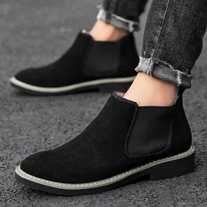 Black suede Chelsea boots for men featuring elastic side panels and durable rubber soles