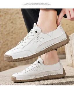 White leather casual shoes with hand-stitched detailing and breathable perforations