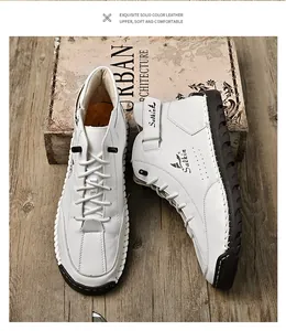 Detailansicht weißer Leder-Freizeitschuhe mit Handnaht und dem Salkin-Logo-Design.