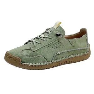 Casual green leather sneakers for couples featuring handmade stitching and rubber sole