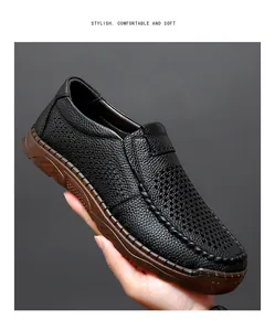 Close-up detail of black leather men's slip-on shoes featuring a breathable hollow-out design