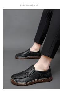 Close-up of men's black perforated leather loafers for breathable summer comfort.
