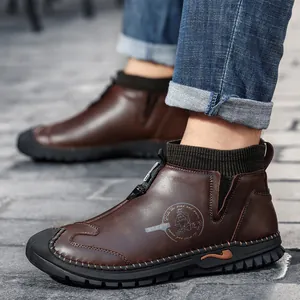 Stylish men's brown leather casual boots featuring hand-stitched soles and knit ankle collars