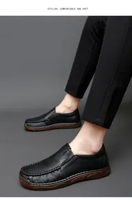Professional on-foot detail view of men's soft black leather loafers showing texture