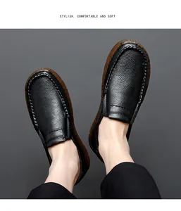 Detail view of men's black pebble grain leather loafers being worn, soft casual shoes