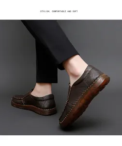 Side view of men's brown leather loafers with high quality stitching and texture