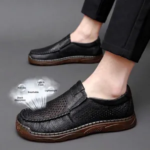 Men's black casual leather loafers with breathable laser-cut holes and rubber sole