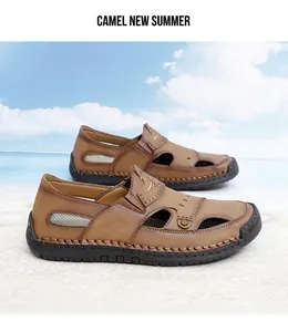 Men's brown leather beach sandals with breathable cut-outs on a beach background