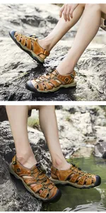 Detailed close-up view of durable men's brown leather outdoor sandals on rocky terrain