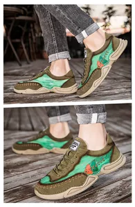 Detailed side view of men's trendy olive green casual sneakers with contrast stitching