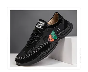 Mens black casual sneakers with octopus-style soles and grey decorative stitching
