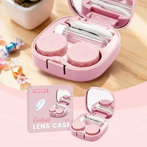 Roze draagbare contactlenshouder set met spiegel, pincet en de retail verpakking