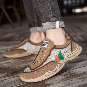 Trendy men's earth-tone lace-up casual sneakers with decorative stitching and thick sole.