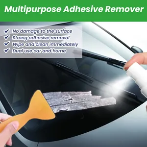 Close-up of multipurpose adhesive remover spray used on car glass with a scraper tool