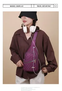 Stylish woman wearing a purple quilted sling bag with headphones, casual lifestyle view