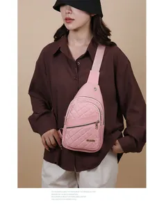 Pink quilted crossbody chest bag for women shown on a model in a casual studio setting