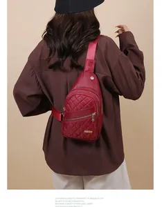 Detail of the burgundy quilted chest bag showing the back wearing style