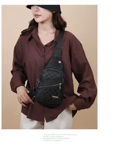 Fashionable black quilted chest bag for women styled with a casual brown shirt
