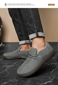 Close-up of grey suede men's casual outdoor shoes with white stitching