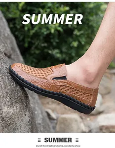 Detail view of brown breathable mesh summer slip-on shoes for men on outdoor rock
