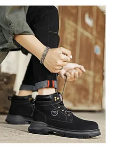 Close-up of black leather Martin boots with sport logo and rugged rubber sole