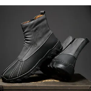 Detail showing the textured upper and side zipper of men's winter snow boots.