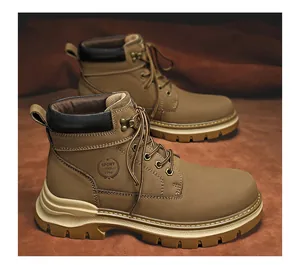 High detailed view of brown leather Martin boots with embossed Sport 1996 side logo