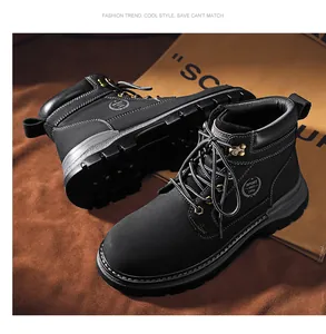 Close-up of durable black top-grain leather Martin boots with a high-top work boot design.