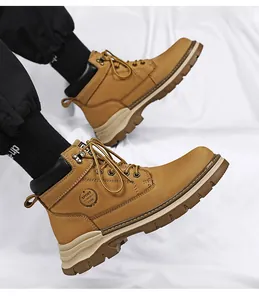 Detailed side view of camel leather Martin boots featuring durable lug soles and sport logo