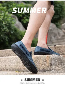 Close-up macro view of blue hollow-out mesh loafers for men walking on outdoor stone steps