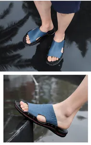 Close-up detail of men's casual blue crocodile pattern sandals with non-slip soles
