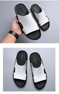Detail view of men's casual slippers with white crocodile texture and black sole